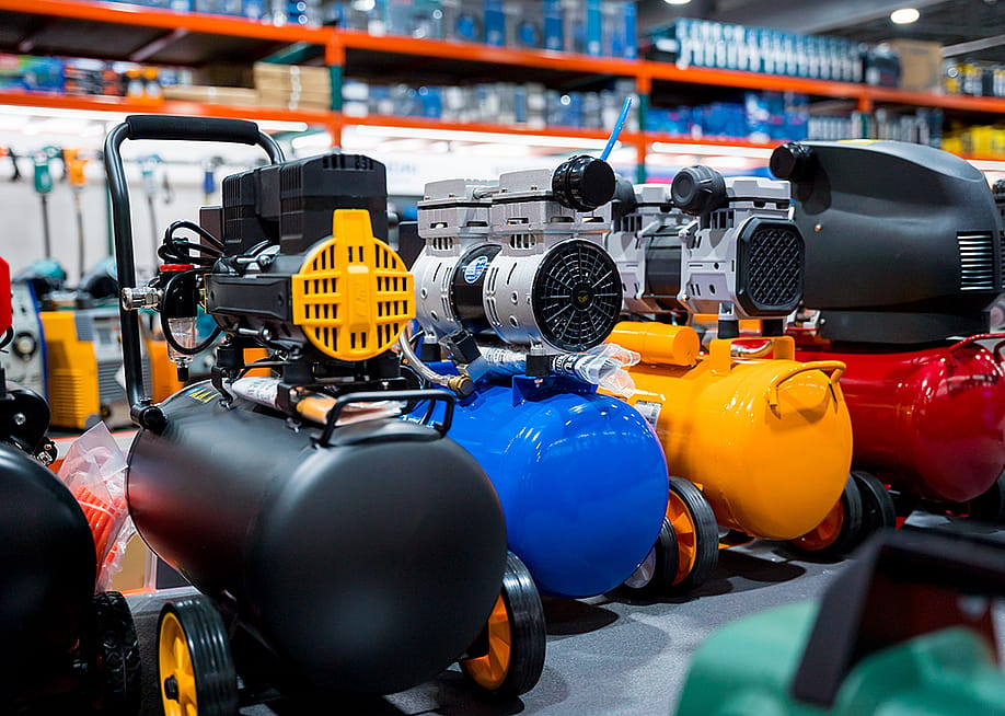A shop's showcase of new air compressors. — Roman Zaiets // Shutterstock