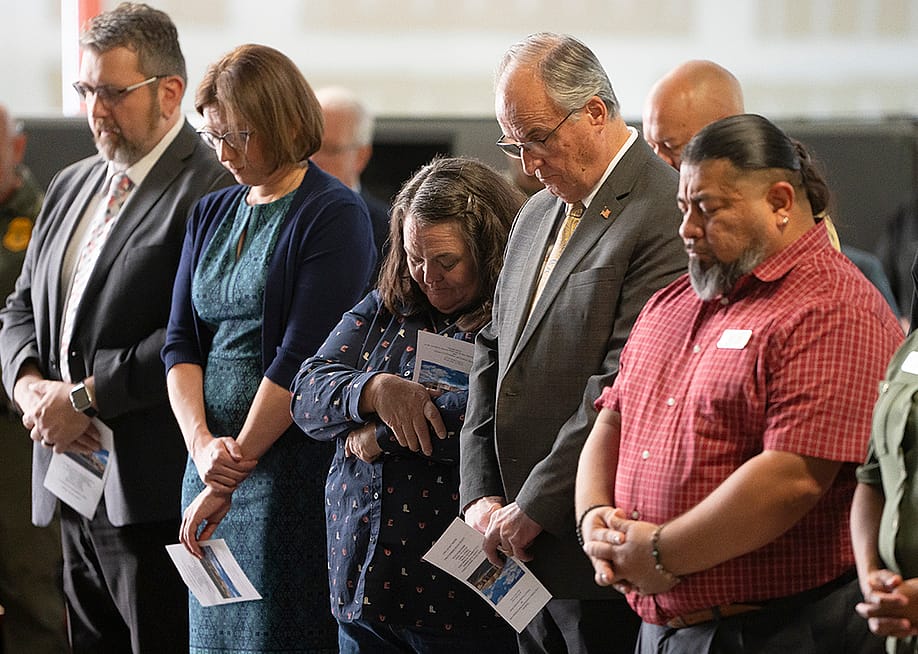 Cochise County Supervisor Peggy Judd, center, bows her head in prayer during the inauguration of the Southern Arizona Regional Border Operations Center in Sierra Vista, Arizona. — Rebecca Noble // The Washington Post via Getty Images