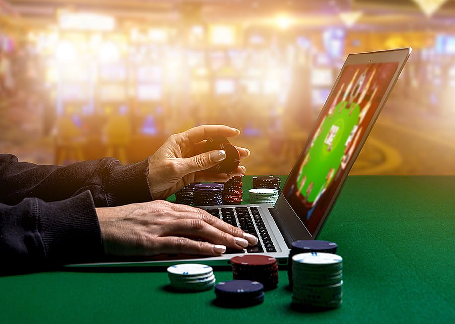 Person using laptop playing online casino. — Clari Massimiliano // Shutterstock