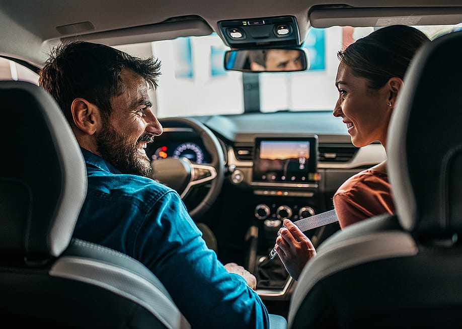 Couple inside a brand new car. — hedgehog94 // Shutterstock
