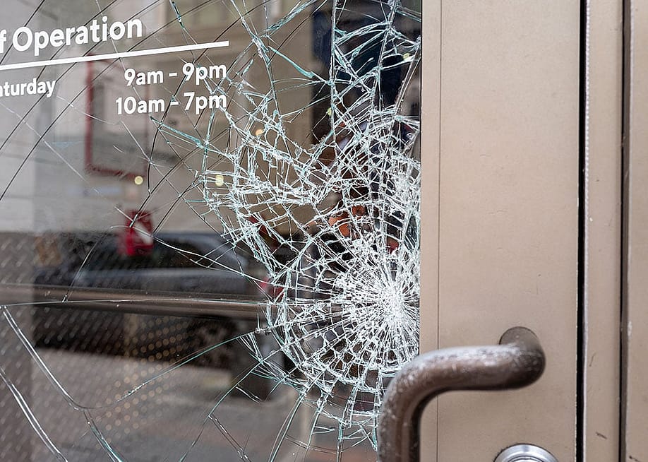 Broken shattered window of a store. — Kathy images // Shutterstock