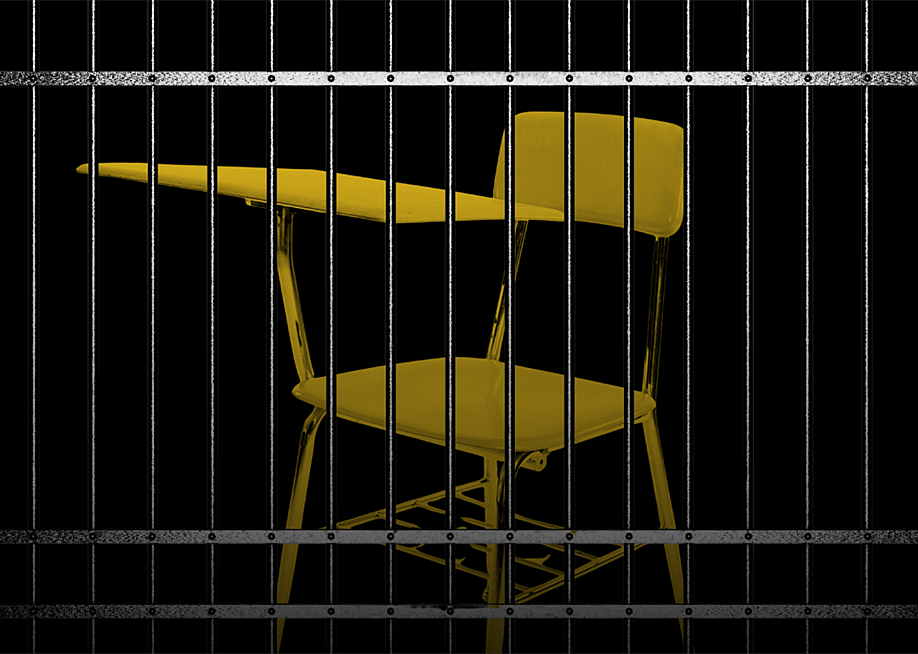A school chair behind bars. — Meghan Gallagher // The 74