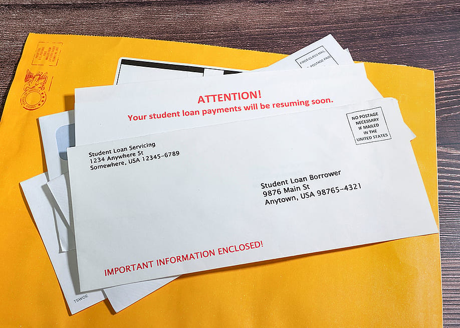 Pile of student loan notices sent by mail. — Rix Pix Photography // Shutterstock