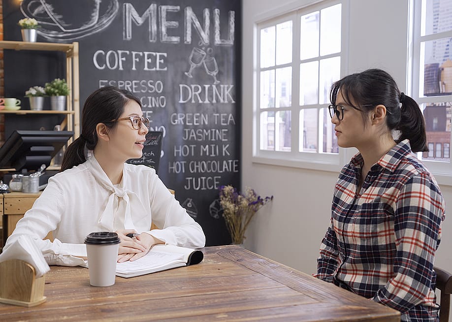 Cafe business owner interviewing a candidate for the business marketing staff. — PRPicturesProduction // Shutterstock