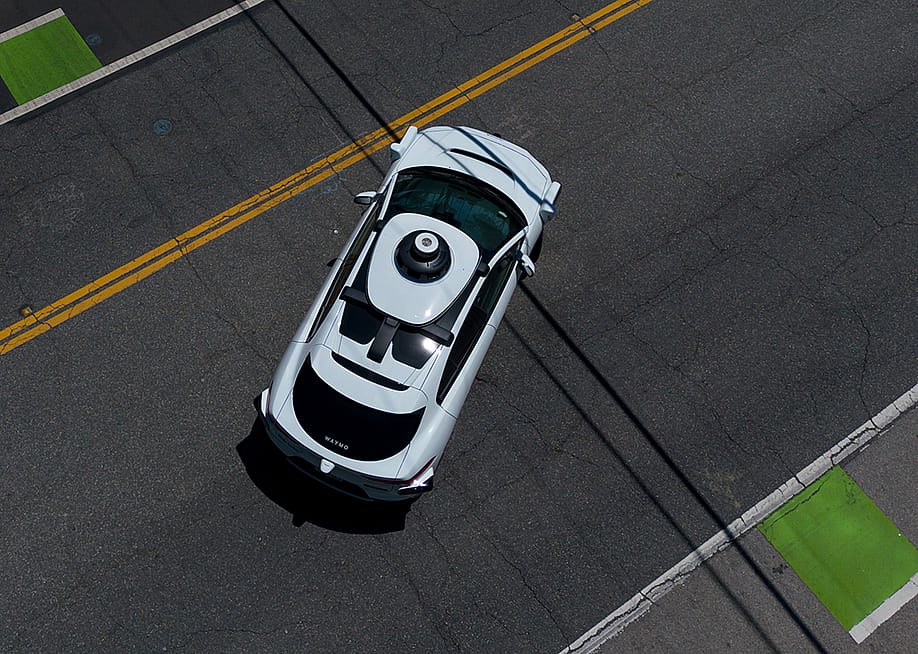An aerial view of a Waymo vehicle on a street in Santa Monica, California. — Eric Thayer // Getty Images