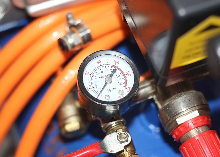 The pressure gauge of an air compressor. — Satharayathra // Shutterstock