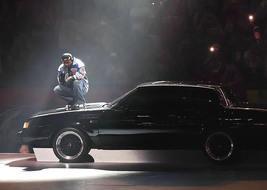 Kendrick Lamar on top of a car during his Super Bowl LIX Halftime Show. — Cindy Ord // Getty Images