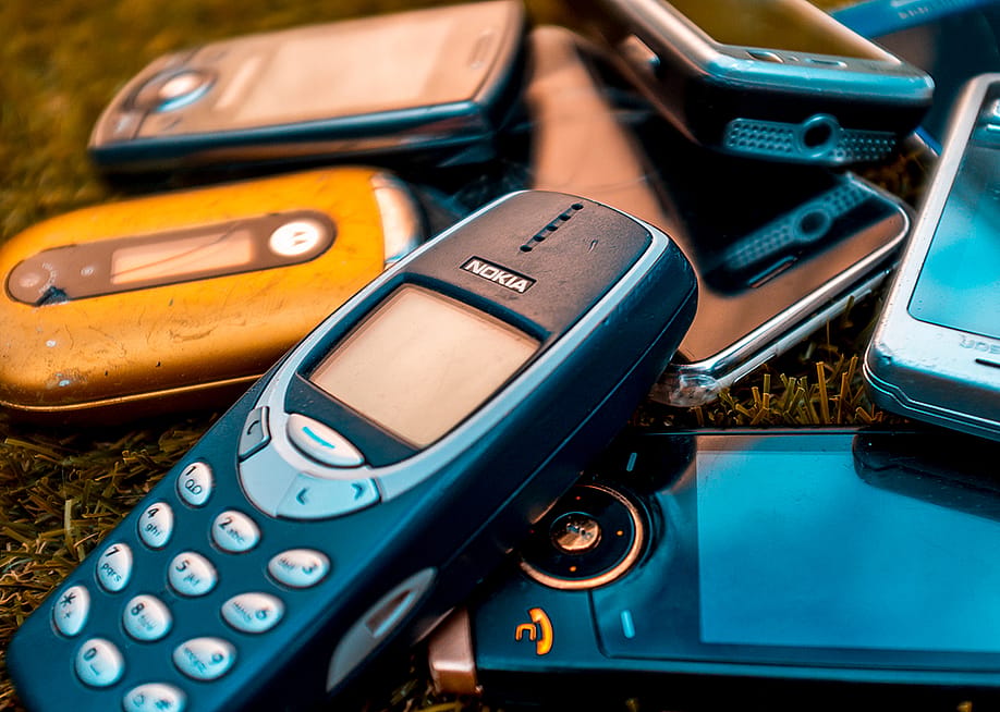 Old mobile phones from the mid-2000s. — Lenscap Photography // Shutterstock