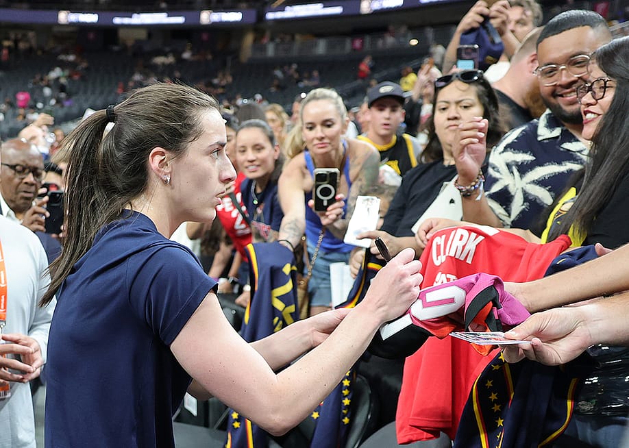 Caitlin Clark #22 of the Indiana Fever signs autographs for fans after warming up before a game against the Las Vegas Aces at T-Mobile Arena on June 22, 2025 in Las Vegas, Nevada. — Ethan Miller // Getty Images