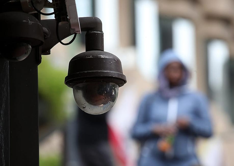 Close up of a video surveillance camera hanging from the side of a building in San Francisco. — Justin Sullivan // Getty Images