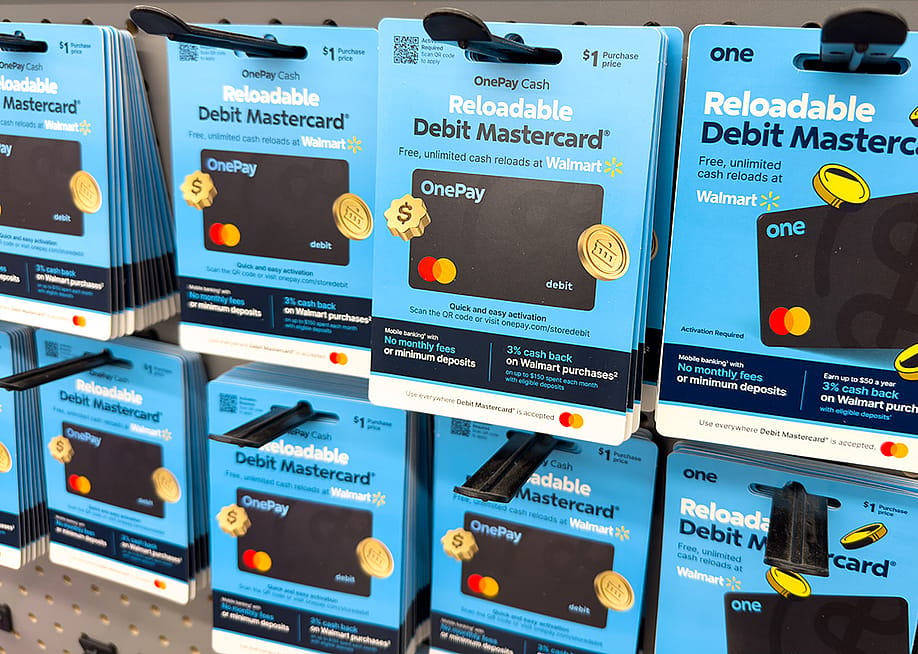 Debit Mastercard on display at a retail store. — ZikG // Shutterstock