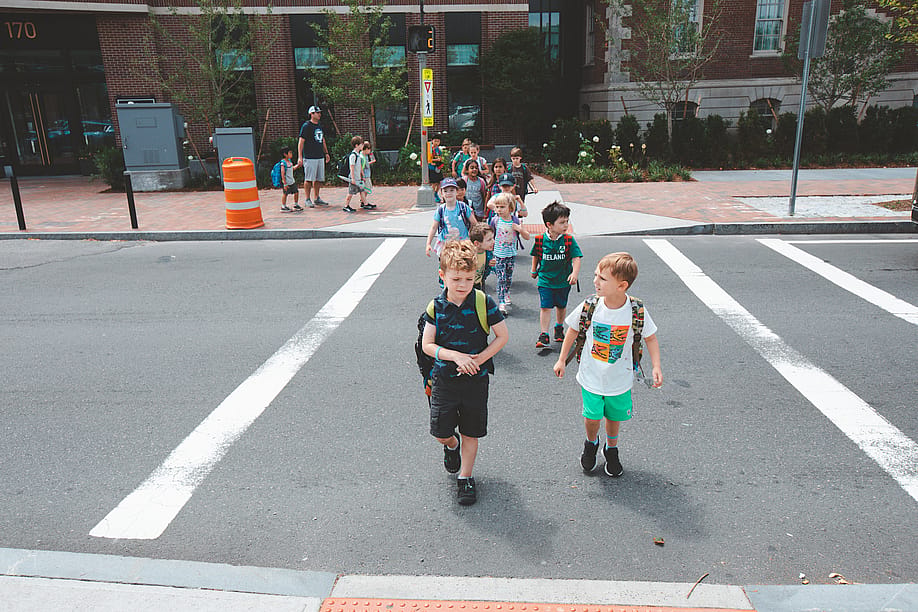 Kindergarten children group walking on crosswalk at Charles Street in Boston. — 2p2play // Shutterstock