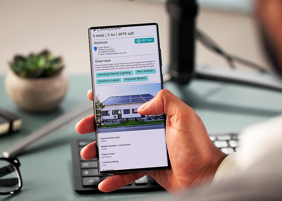 Person looking at the details of a house online. — Andrey_Popov // Shutterstock