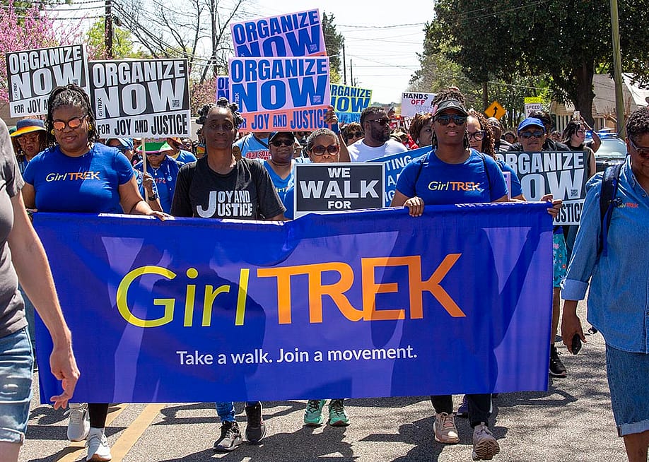 GirlTREK participates in a walk to the Alabama state capitol as part of the 60th anniversary celebration of the historic 1965 Selma to Montgomery. — Jim West // UCG / Universal Images Group via Getty Images