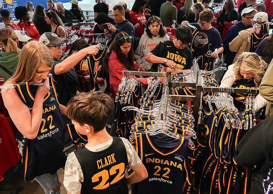 Fans looking at the merchandise in the team store before the game between the New York Liberty and the Indiana Fever at Gainbridge Fieldhouse, Indiana. — Dylan Buell // Getty Images