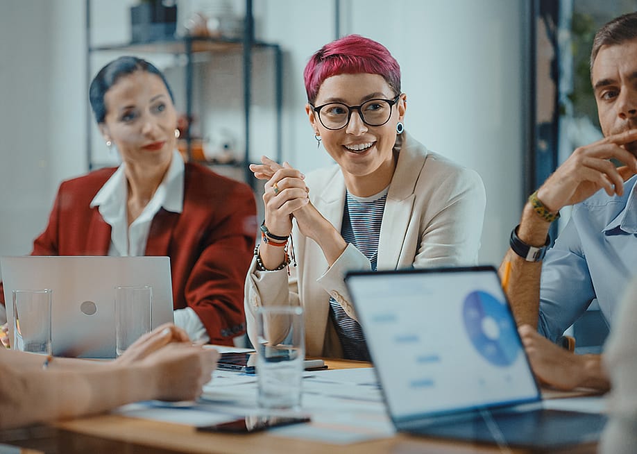 A business team having a meeting at the office. — Gorodenkoff // Shutterstock