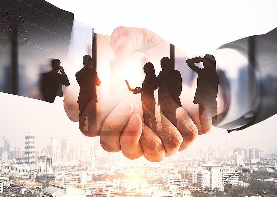 Illustration of businesspeople and a handshake. — Golden Dayz // Shutterstock