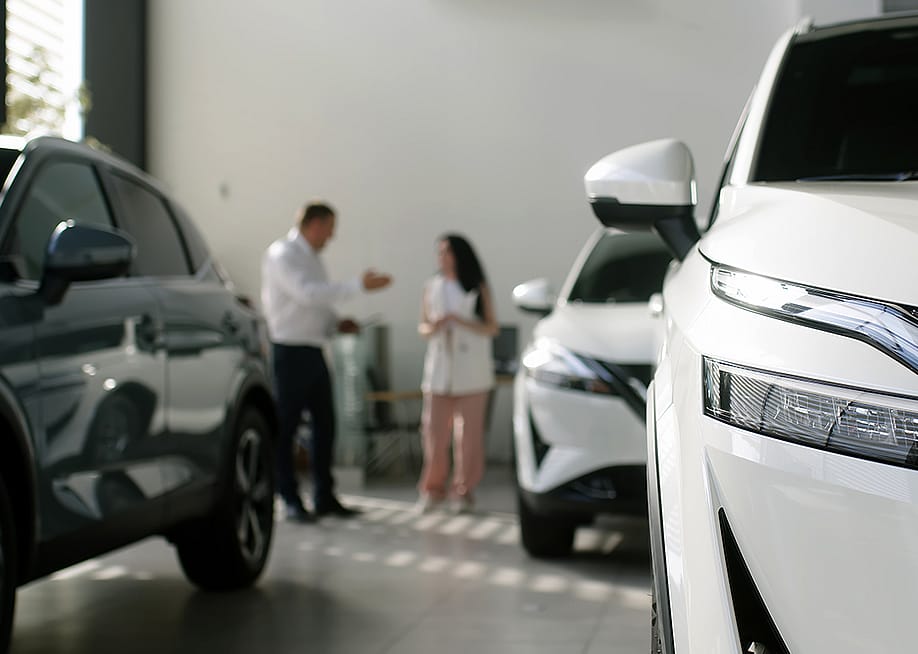 A manager and an interested buyer in a car dealership. — wedmoments.stock // Shutterstock