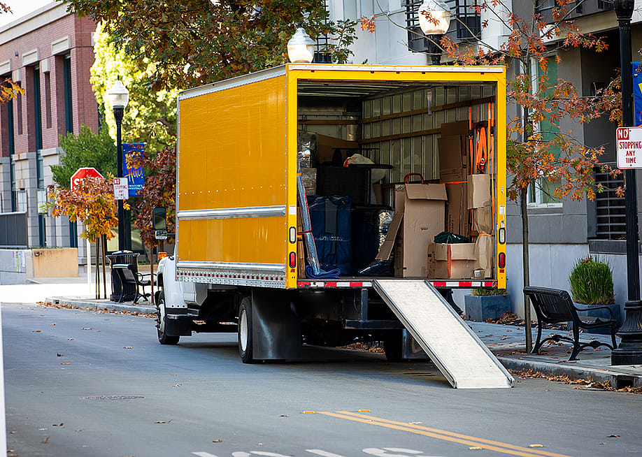 A moving truck parked on a residential street in Sunnyvale, California. — bluestork // Shutterstock