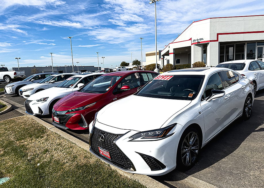 Row of used cars for sale. — ZikG // Shutterstock