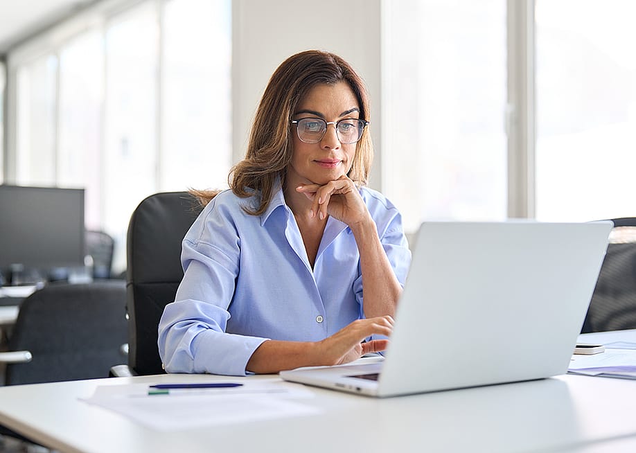 Middle-aged businesswoman in a corporate office. — insta_photos // Shutterstock