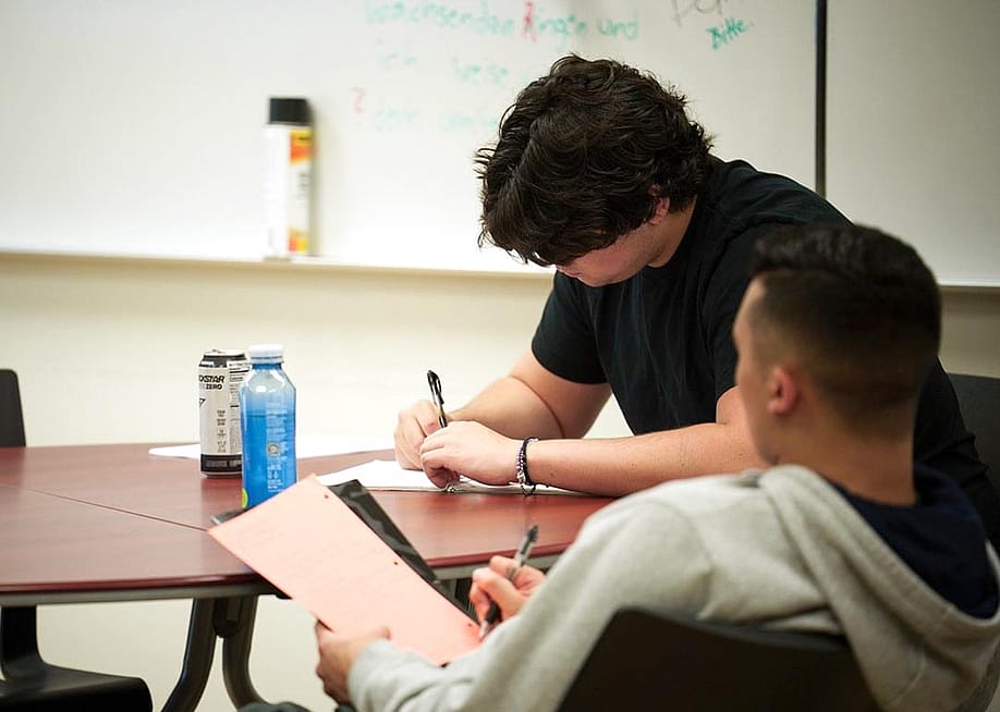 Students take notes during Dr. Adam Kaiserman's English class at College of the Canyons in Santa Clarita. — Jules Hotz for CalMatters