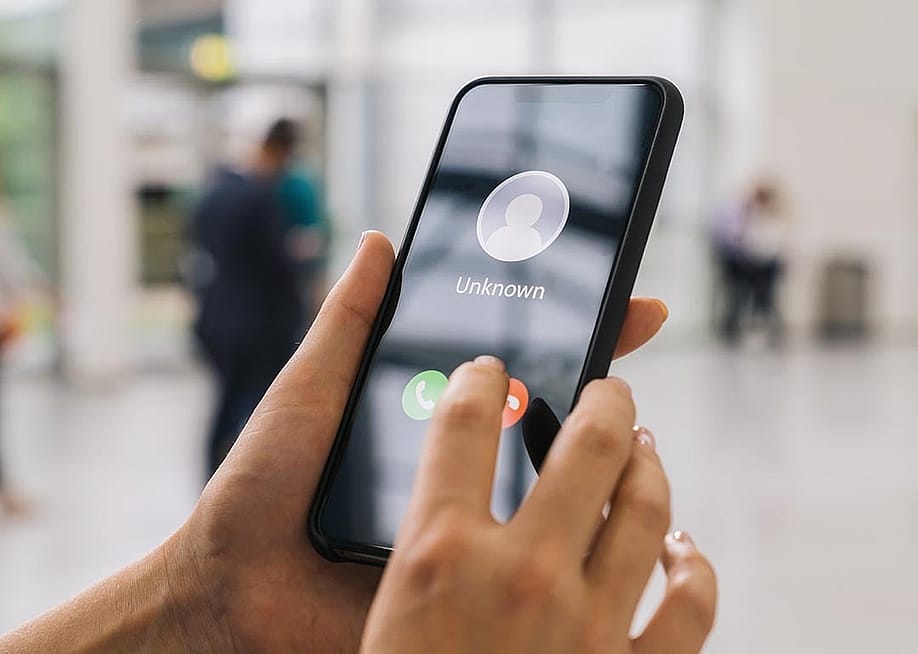 Person holding a cell phone. — r.classen // Shutterstock