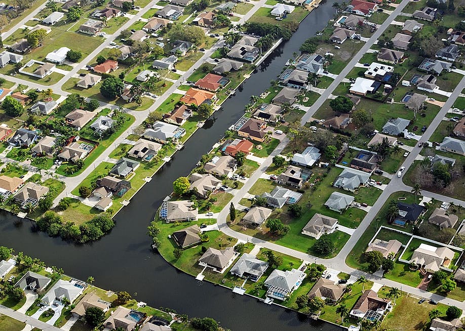 Aerial view of homes in Ft. Myers with canals visible. — Tara Mier for Wealth Enhancement Group