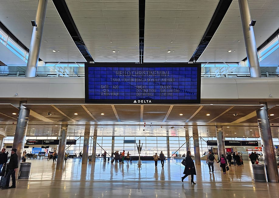 View of the Parallel Reality Experience, a personalized large screen monitor with flight information for Skymiles members at the Salt Lake City Airport. — Kirk Fisher // Shutterstock.com