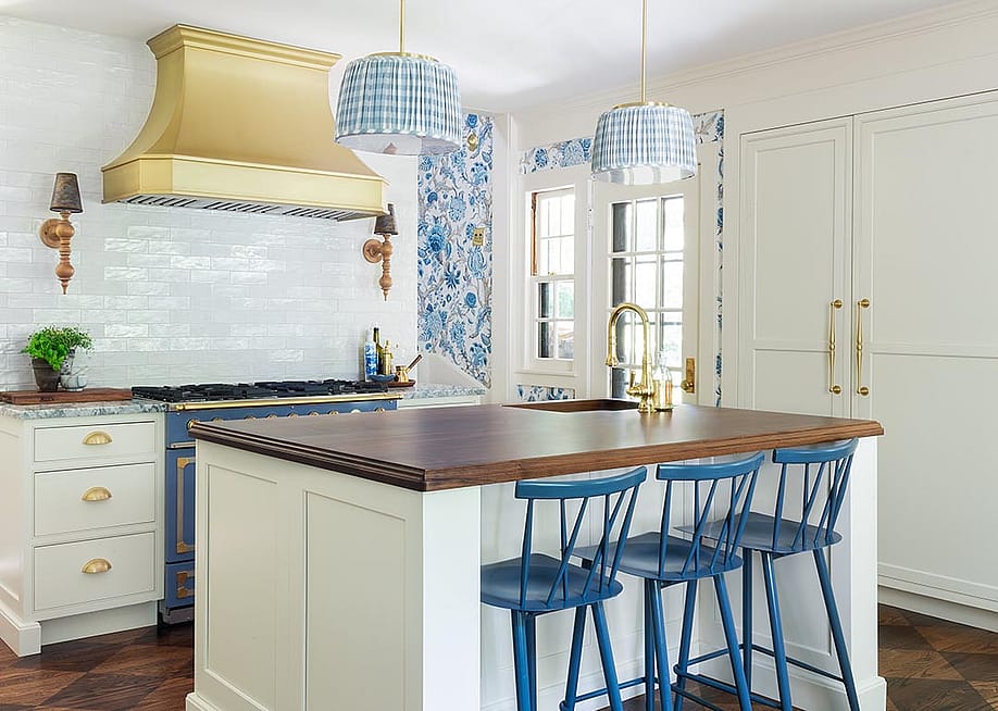 French style country kitchen with white tile, dark countertops and blue and white wallpaper accents. — Erin Kestenbaum