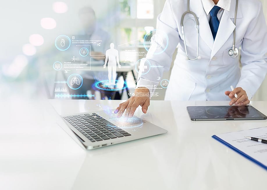 Doctor using laptop with elements of futuristic icons superimposed, symbolizing AI and technology. — create jobs 51 // Shutterstock