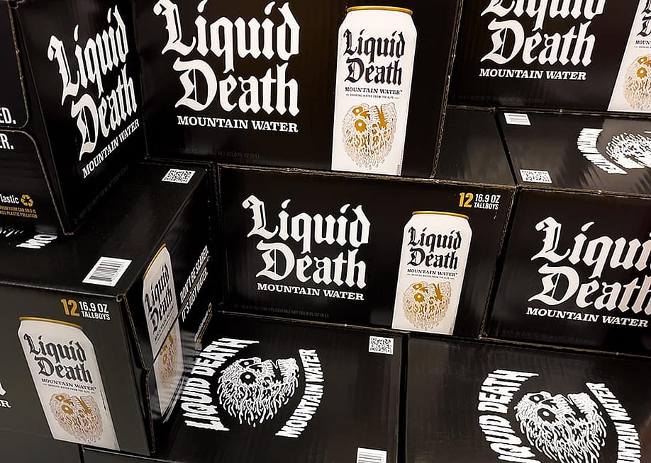 Black boxes of Liquid Death canned mountain water grocery store display. — Scott Habermann // Shutterstock