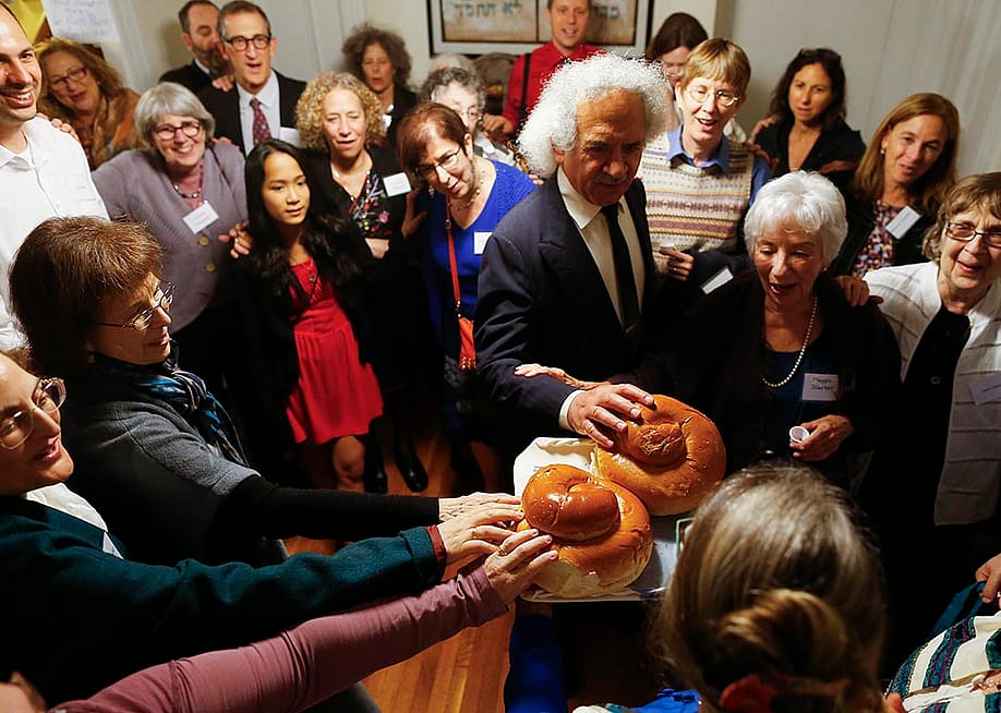 Congregation Eitz Chayim join together for the kiddush during their observance of Rosh Hashana in Cambridge, Massachusetts September 24, 2014. — Jessica Rinaldi // The Boston Globe via Getty Images