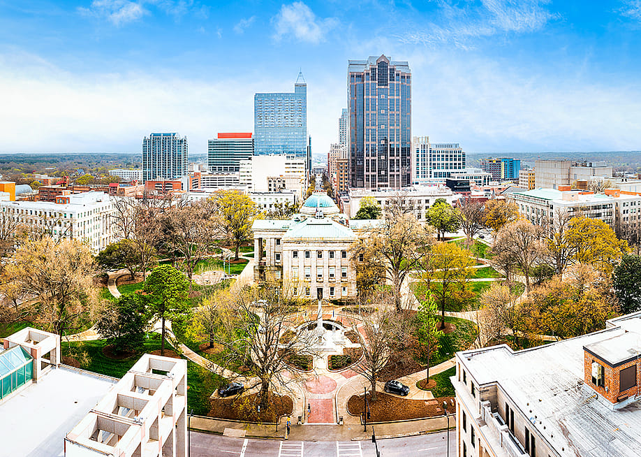 Aerial view of the North Carolina State Capitol and Raleigh skyline. — Mihai_Andritoiu // Shutterstock