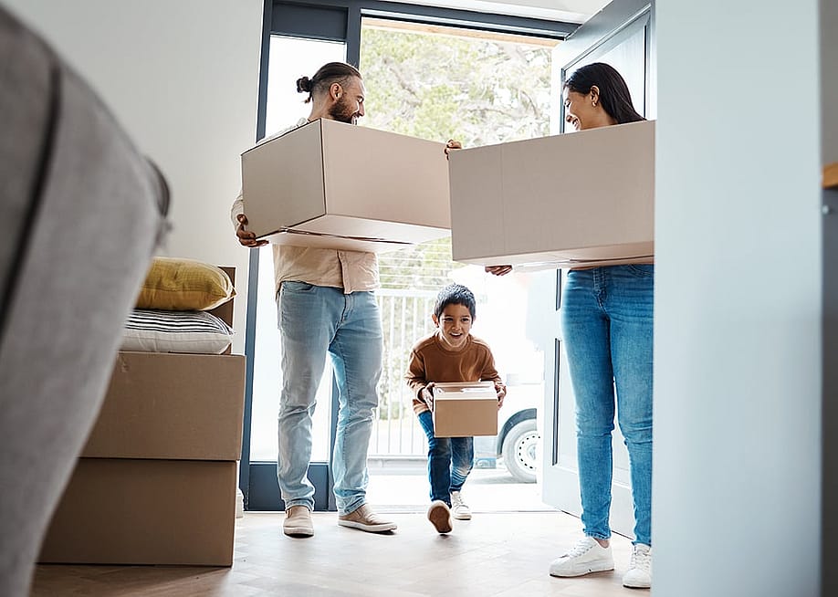 A family moving into their new home. — PeopleImages.com - Yuri A // Shutterstock