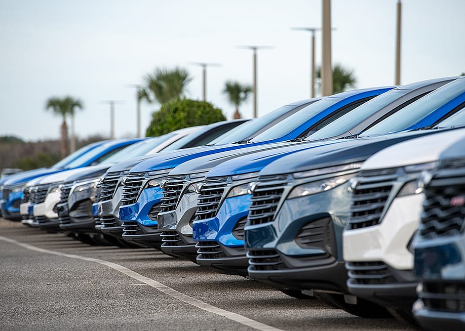 A row of Chevrolet Bolt EUV utility vehicles on a car dealership's parking lot. — Dolores M. Harvey // Shutterstock