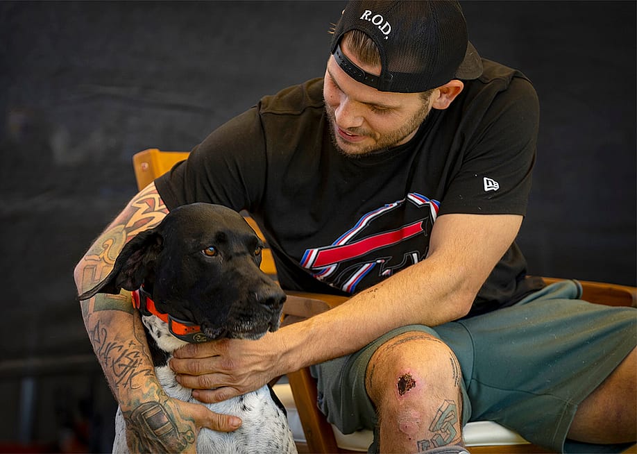 Jacob Schmitt with his dog Buddy, at his home in Ogden, on Thursday, July 31, 2025. — Rick Egan for The Salt Lake Tribune