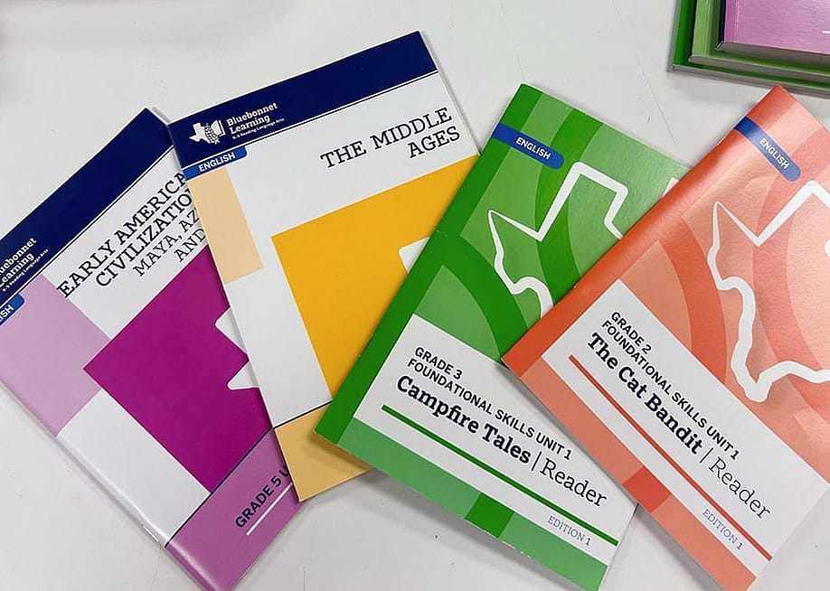 Four Bluebonnet readers in different colors, the new K-5 Texas reading curriculum that includes multiple biblical references. — Courtesy of the Texas Education Agency