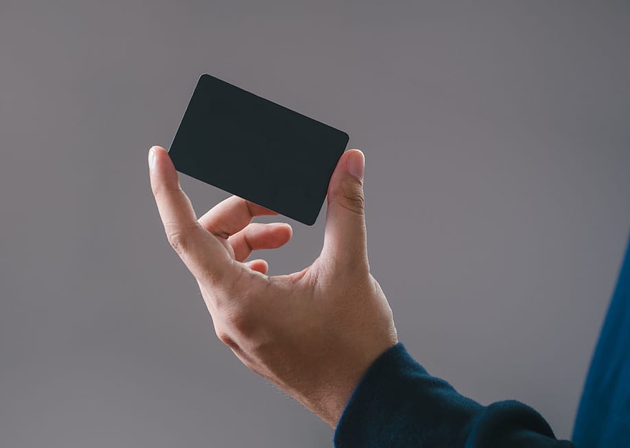 Hand holding a credit card. — ArmadilloPhotograp // Shutterstock