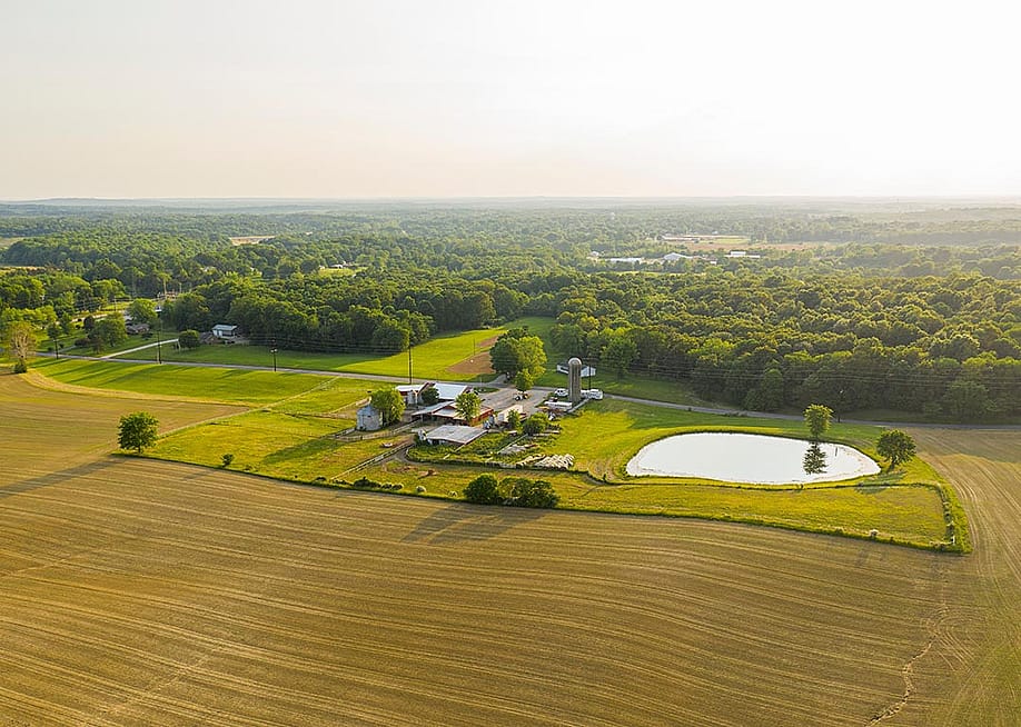 An aerial view of a small farm in southern Indiana during golden hour on a sunny summer day. — Taylor Bunner // Shutterstock
