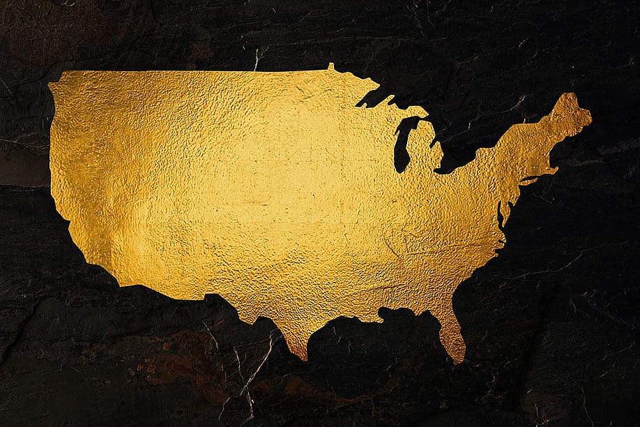 A map of the United States rendered in gold foil. — Runawayphill // Shutterstock