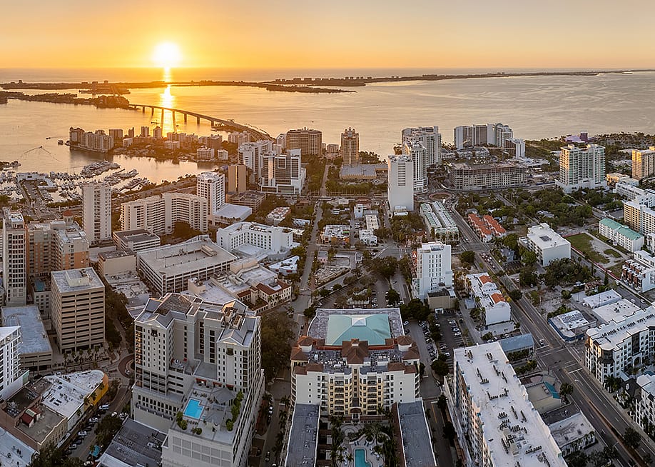 Aerial view of a downtown real estate development in Sarasota City in Florida during sunset. — Bilanol // Shutterstock