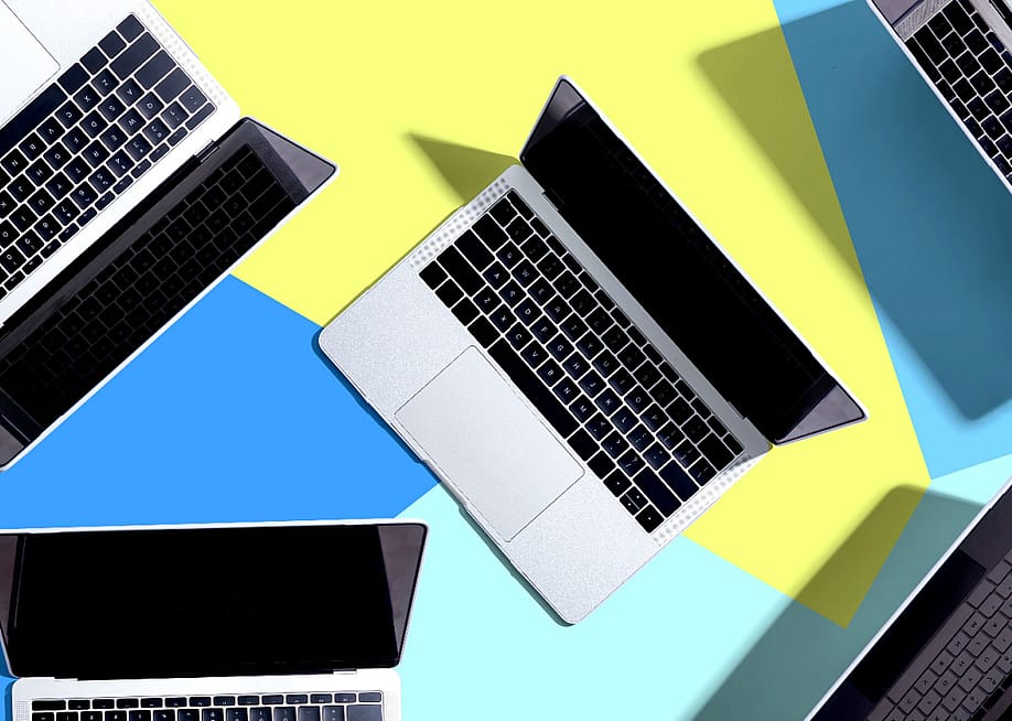 Laptop computer with drop shadow from above — TierneyMJ // shutterstock