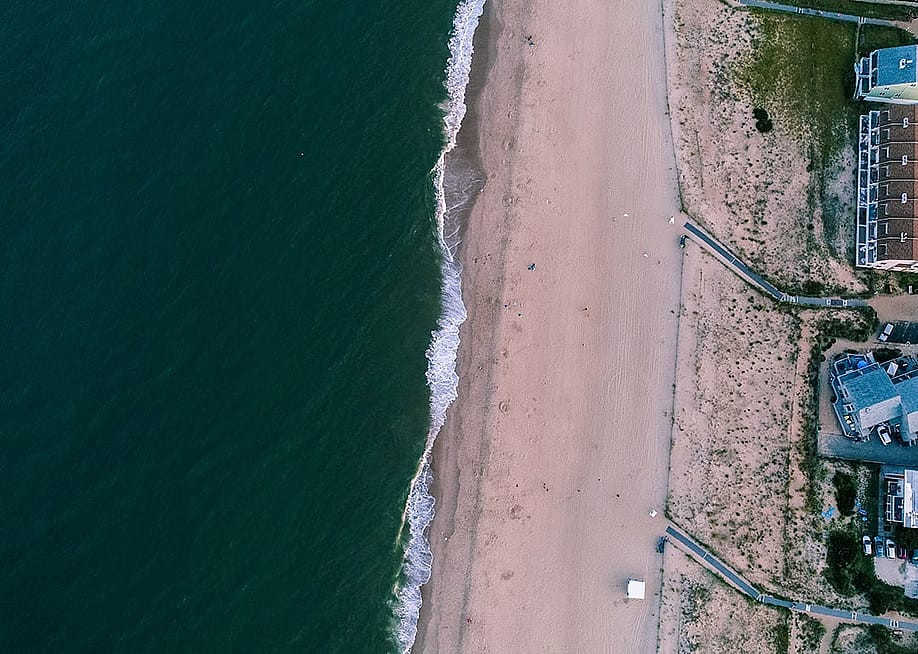 An aerial sunset view of Dewey Beach in Lewes, Delaware. — Nicole Glass Photography // Shutterstock