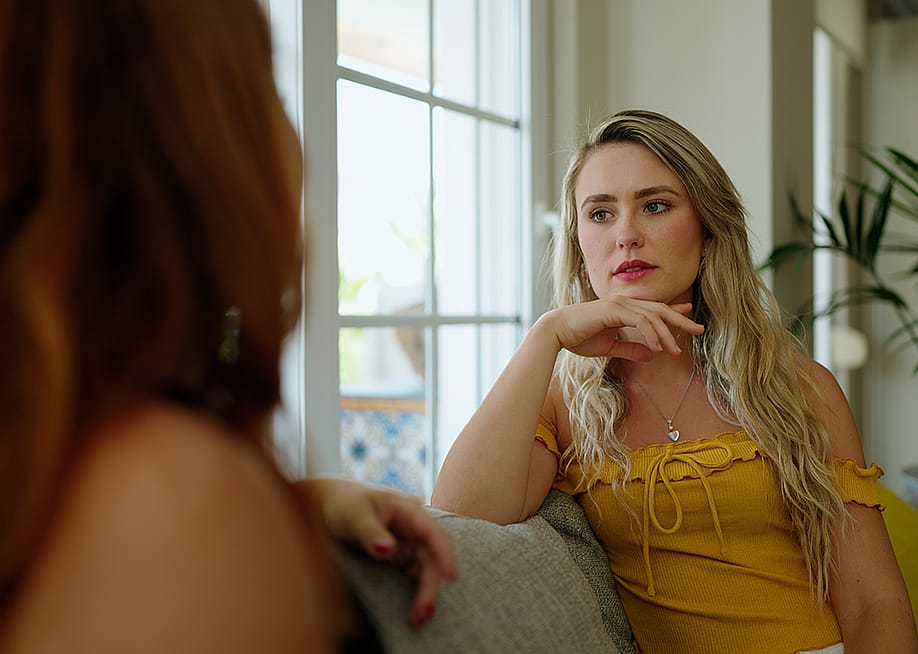 A woman talking to her friend at home. — Krakenimages.com // Shutterstock