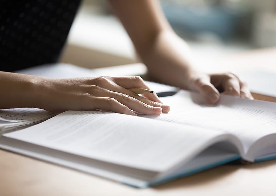 Student reading a book preparing for a college test. — fizkes // Shutterstock
