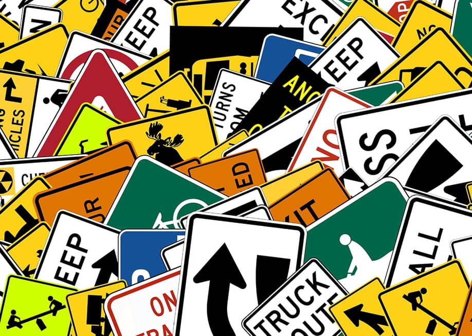 Collage of stacked road signs. — ChiccoDodiFC // Shutterstock