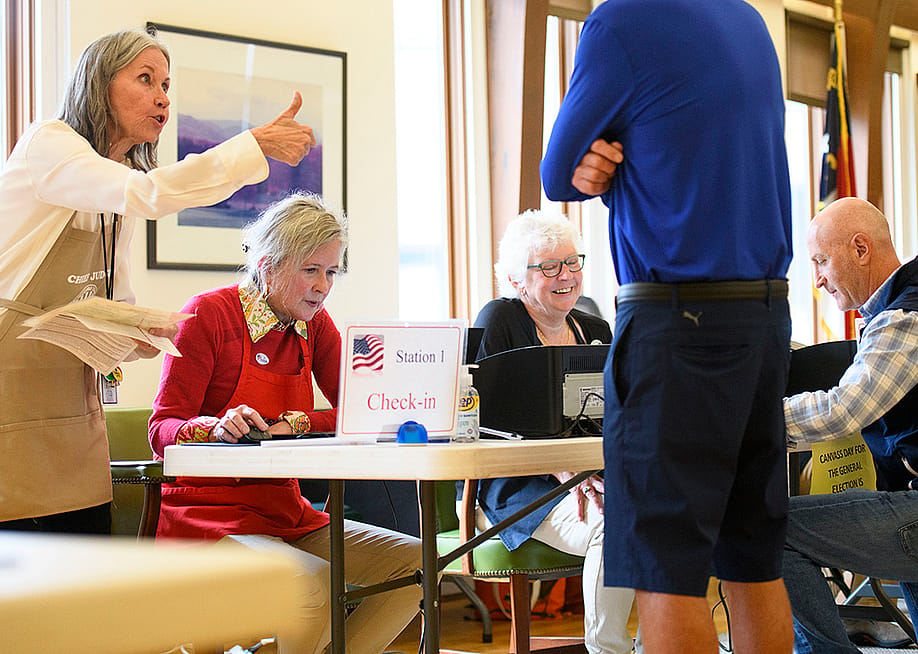 A voter receives a thumbs up from a poll worker after a successful check in at Biltmore Forest Town Hall during the 2024 U.S. election in Asheville, North Carolina. — Melissa Sue Gerrits // Getty Images