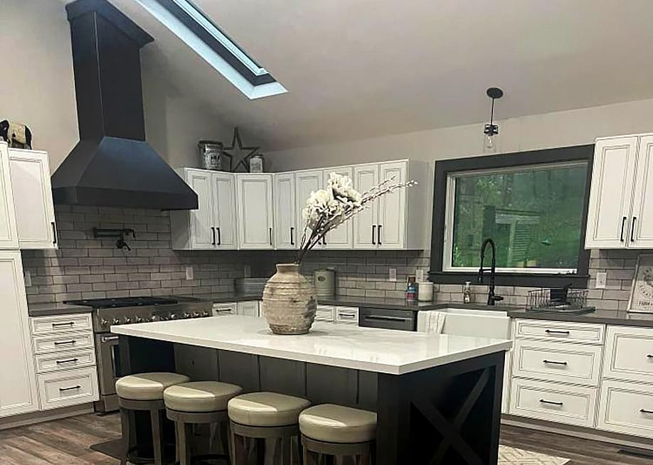 A modern kitchen with a sloped ceiling. — World CopperSmith