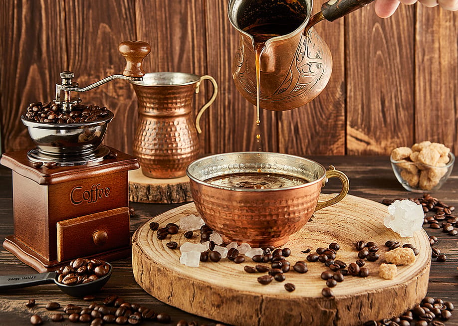 A set of copper coffee set tools. — AlexDonin // Shutterstock